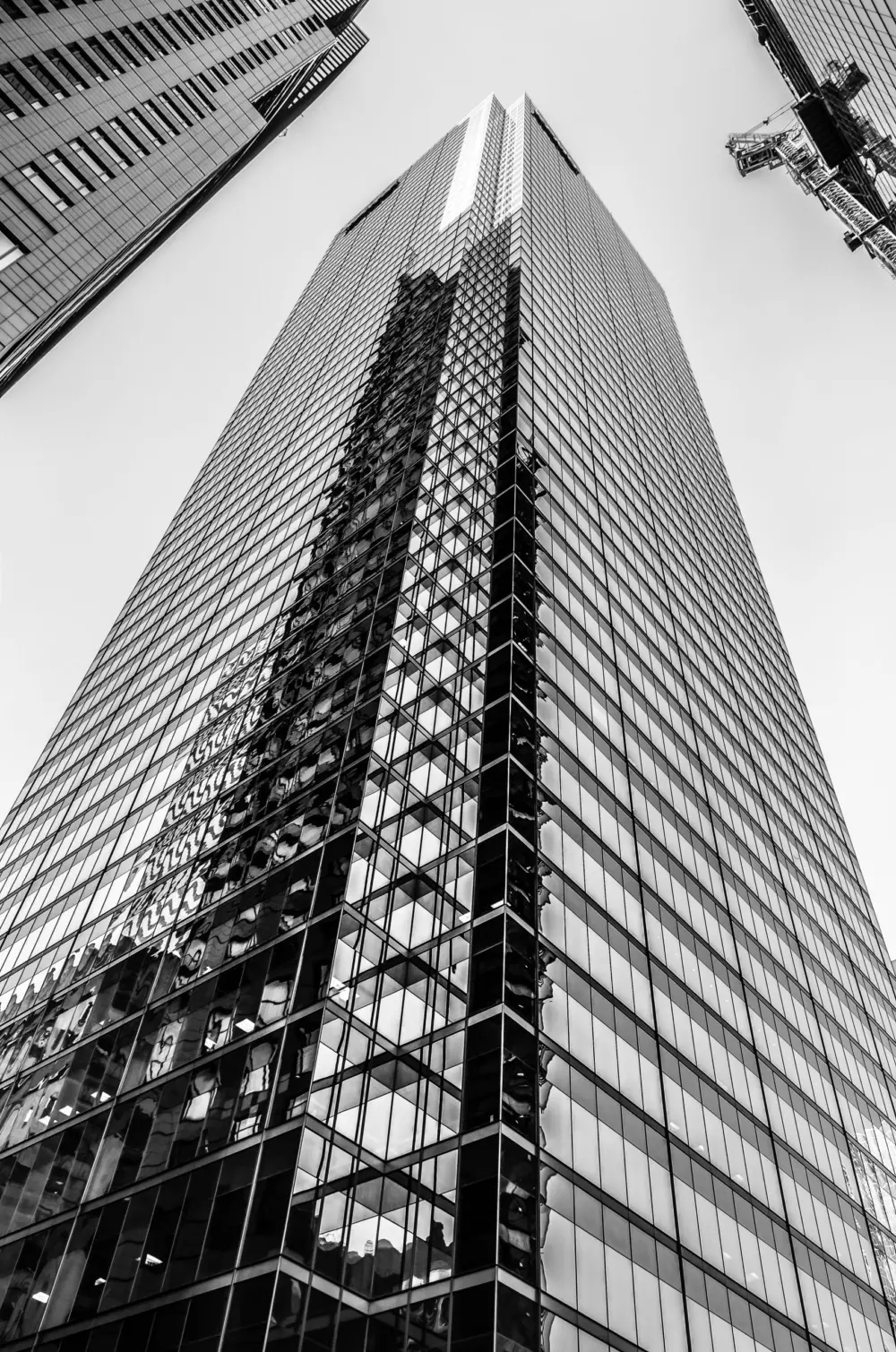 Glass office tower viewed from street level